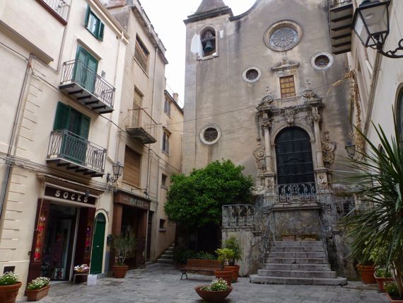 Cefalu church facing salita with socks store