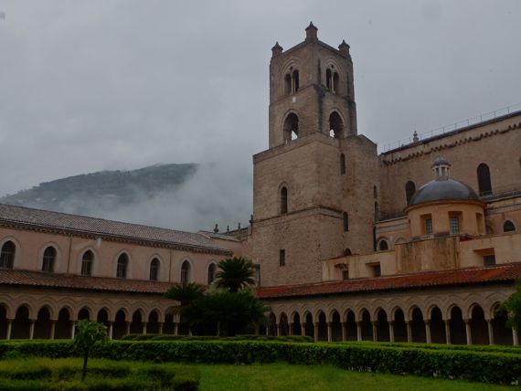 Monreale cathedral rear from cloister with tower cloud breaking up