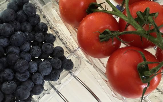 Blueberries tomatoes plastic packs