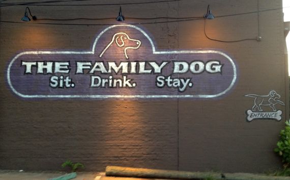 Family dog building sign before dawn