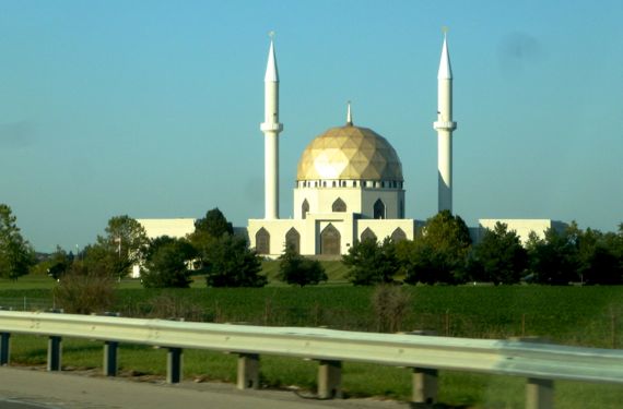 Mosque in sun by highway