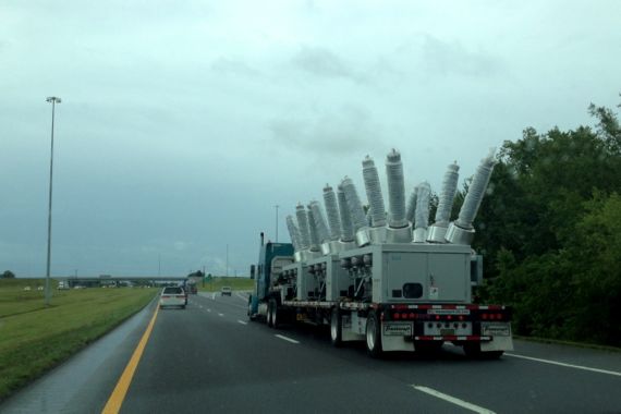 Road truckload robot arms
